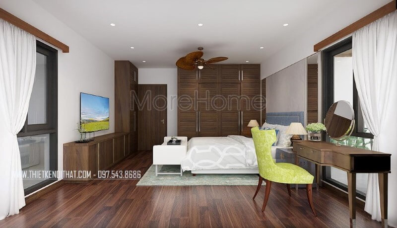 Sàn gỗ, bộ bàn ghế trang điểm, tủ quần áo, kệ tivi, cửa gỗ gỗ óc chó đã tạo nên vẻ đẹp sang trọng, độc đáo trong phong cách hiện đại tại phòng ngủ vợ chồng mặc dù với phong cách này đồ nội thất gỗ công nghiệp thường là lựa chọn phổ biến. Mẫu thiết kế và thi công nội thất biệt thự